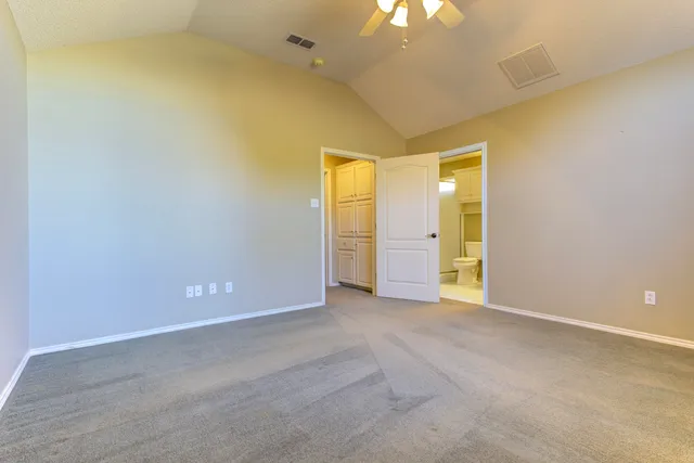 a spacious bathroom with a bathtub and a sink