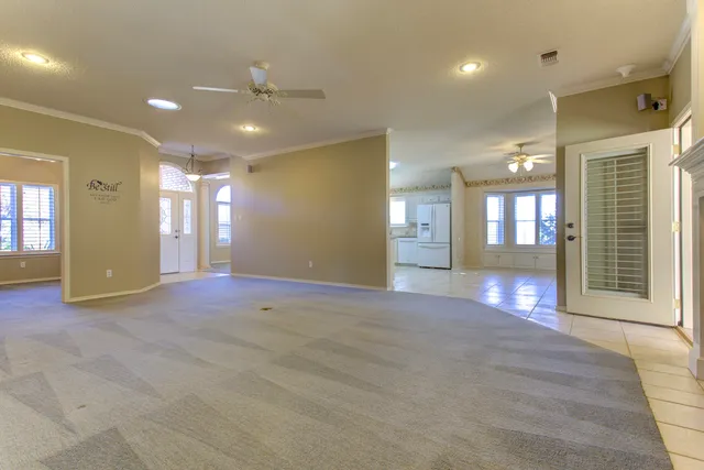 a view of a room with rack on the wall and a window