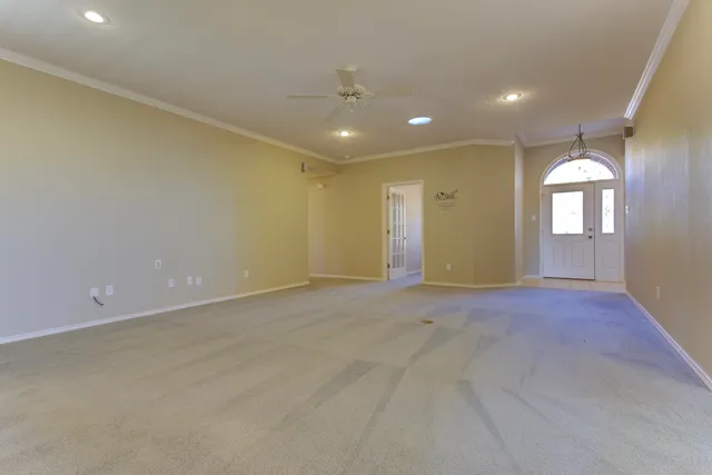 a large kitchen with cabinets and stainless steel appliances