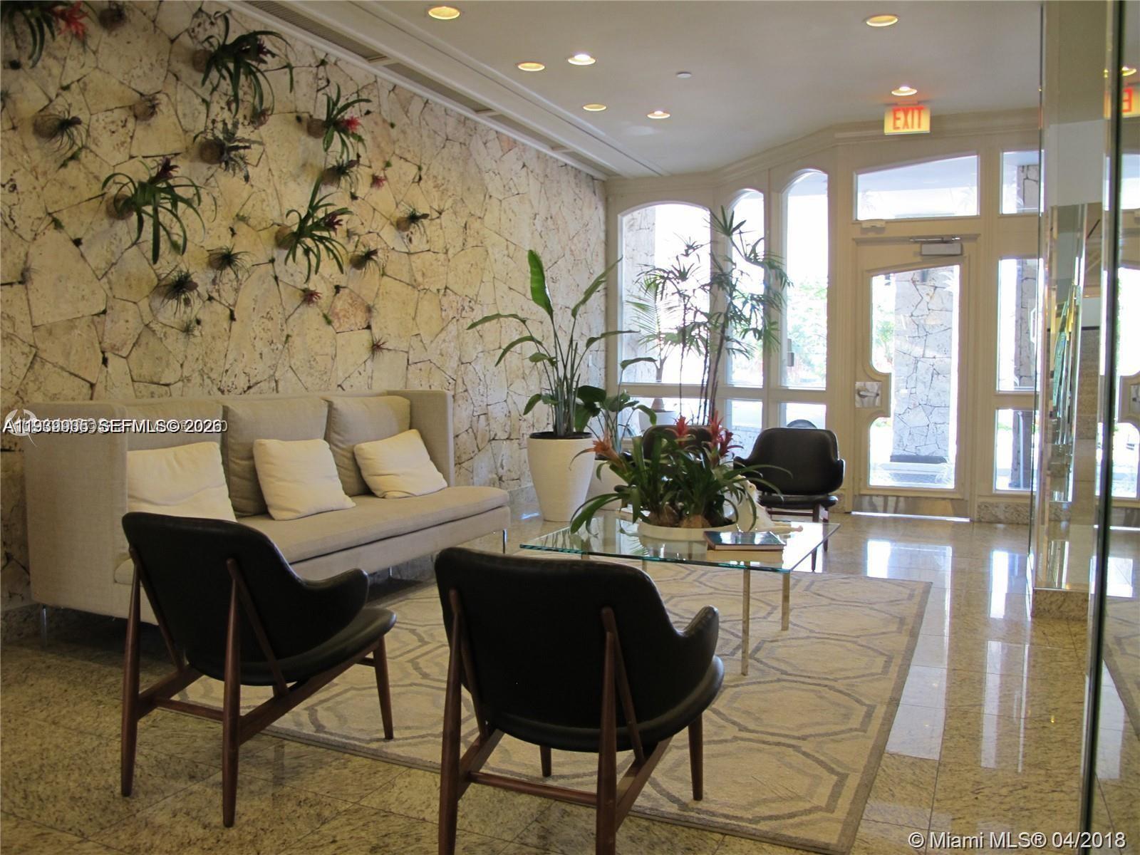 780 Northeast 69th Street, Unit 1207 Miami, FL 33138 - Photo 11 of 12 a living room with furniture and a large window
