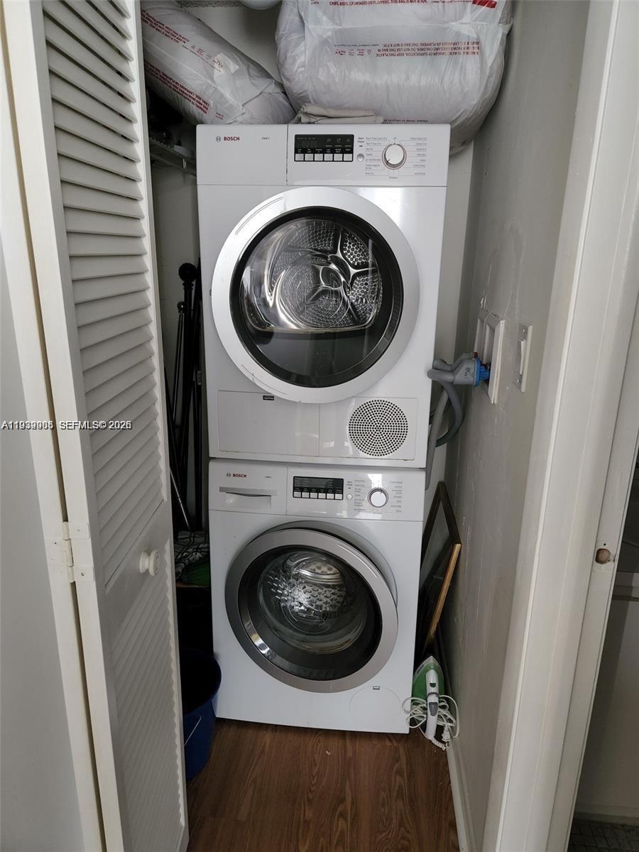 780 Northeast 69th Street, Unit 1207 Miami, FL 33138 - Photo 9 of 12 a utility room with dryer and washer