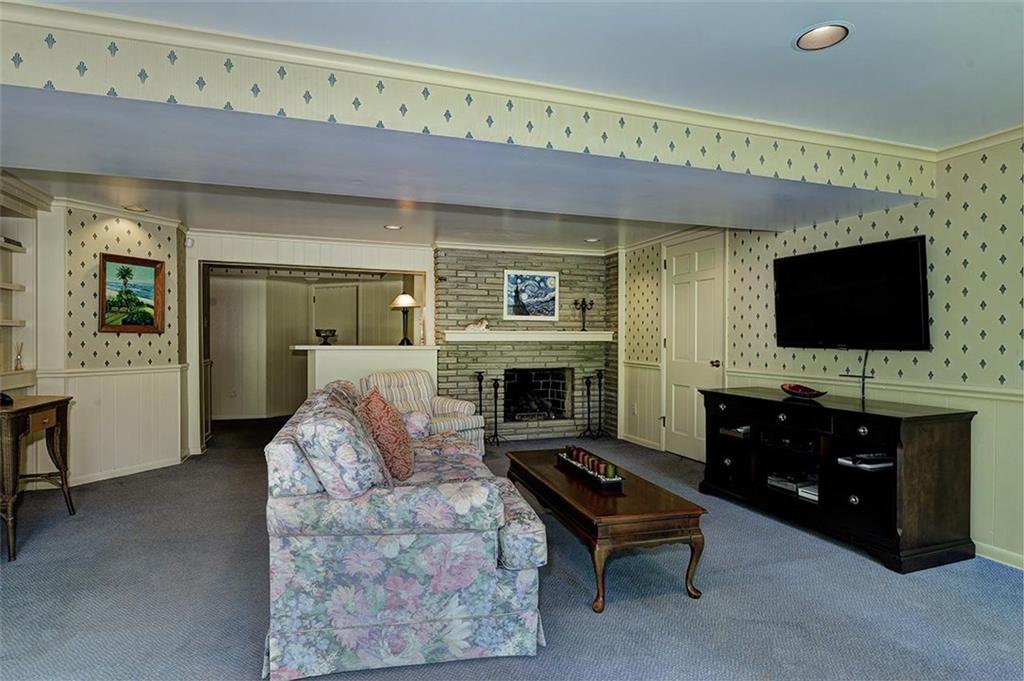 105 Algonquin Road Pittsburgh, PA 15241 - Photo 22 of 25 Fireplace in game room and view of the wet bar.
