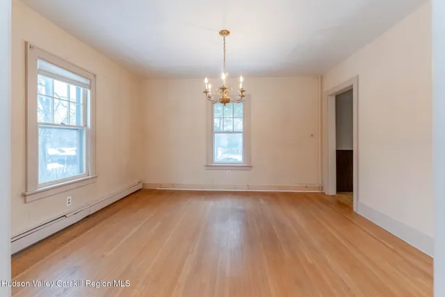 an empty room that has a window in it