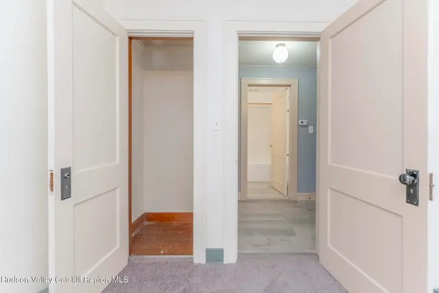 a view of a room with wooden walls