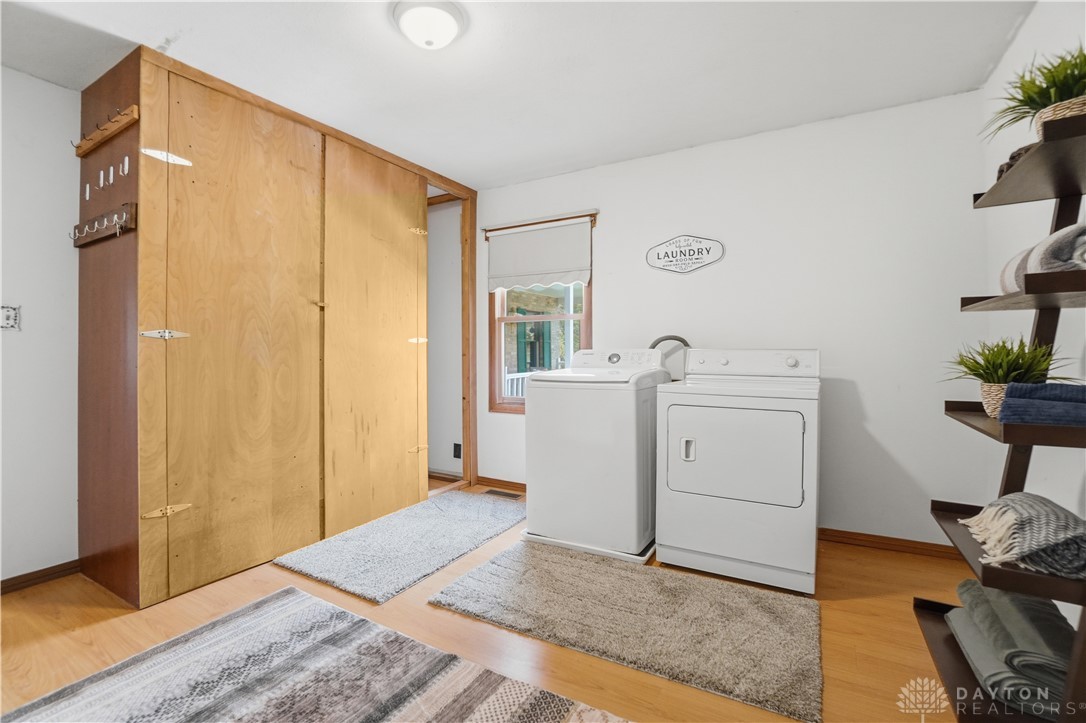 7553 Coffin Station Road Springfield, OH 45502 - Photo 61 of 95 Functional laundry space with a window offers a practical solution for daily chores.