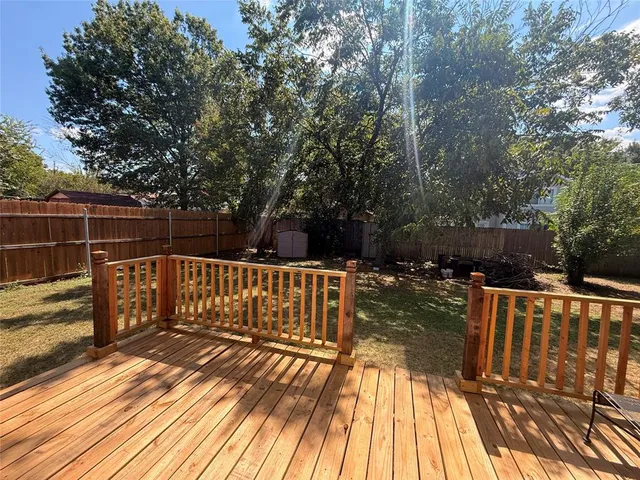 a view of deck with chairs and wooden floor