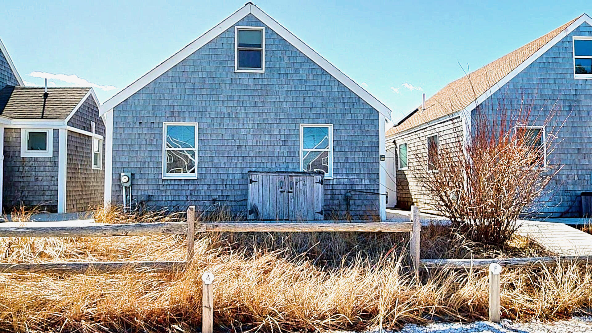 596 Shore Road, Unit G Truro, MA 02666 - Photo 26 of 27 a view of wooden house with a yard