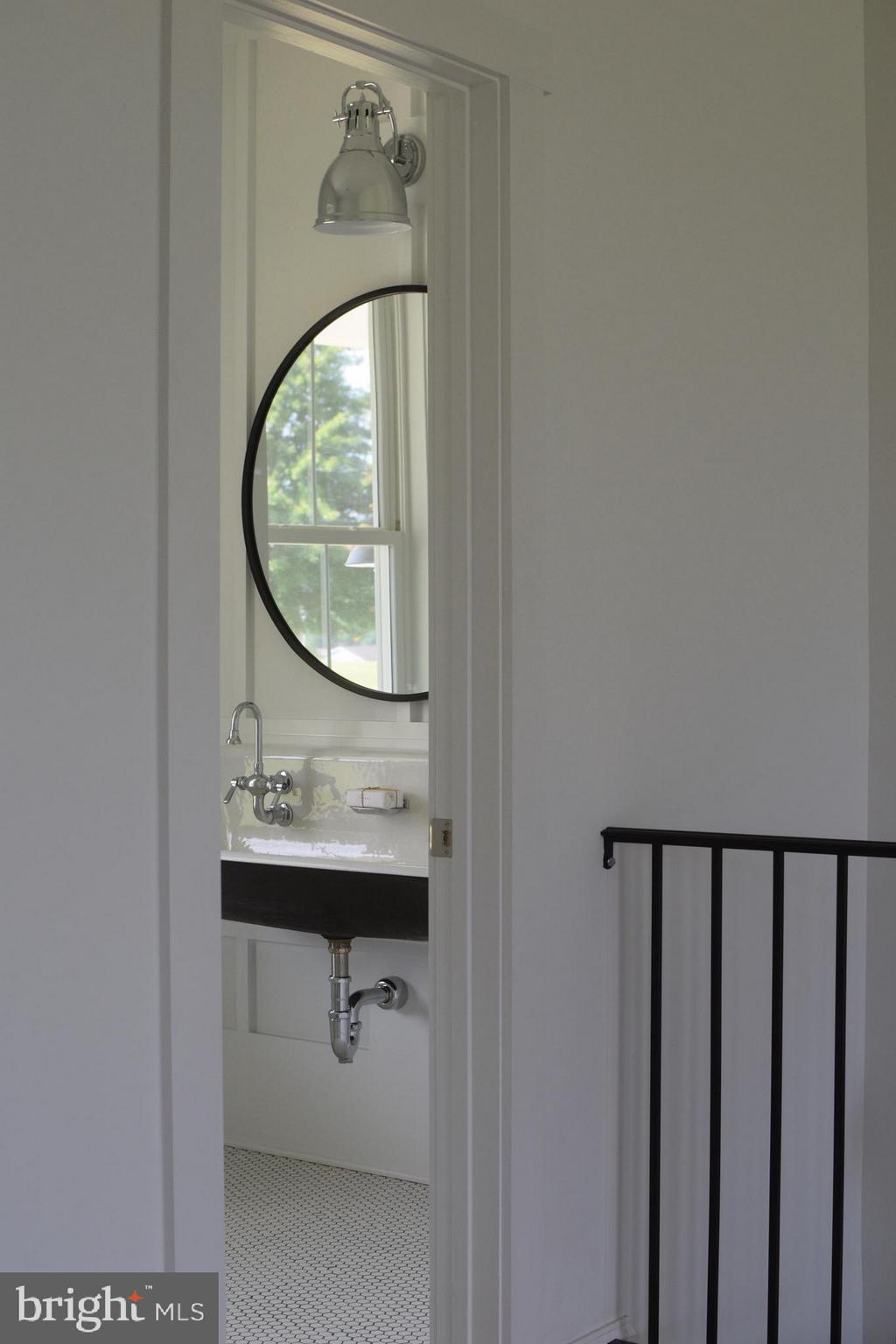 13762 Taylorstown Road Leesburg, VA 20176 - Photo 21 of 36 Half bath off living room with modern trough sink