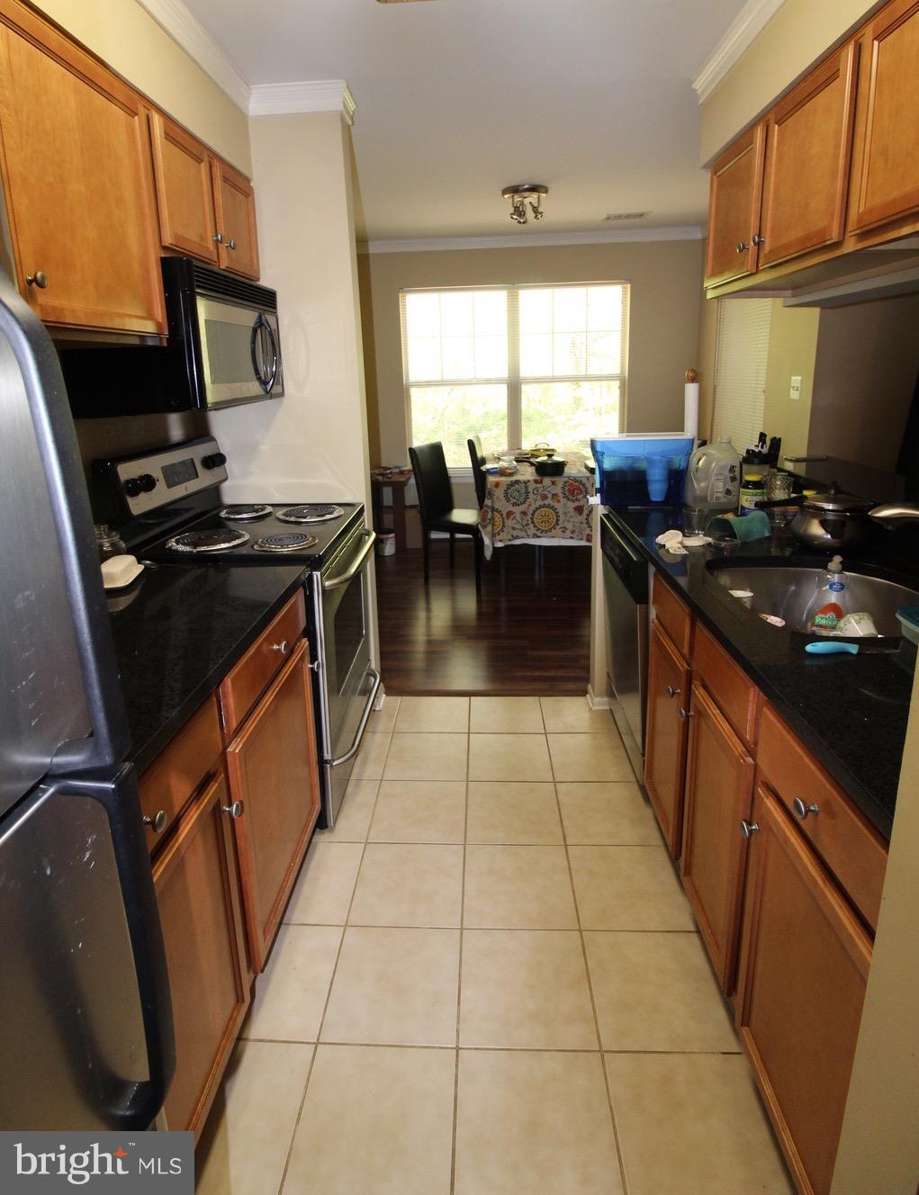 1702 Ascot Way, Unit D Reston, VA 20190 - Photo 2 of 7 Kitchen opens into separate dining room off patio!