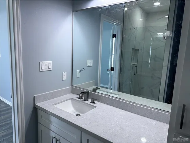 a bathroom with a sink and a mirror