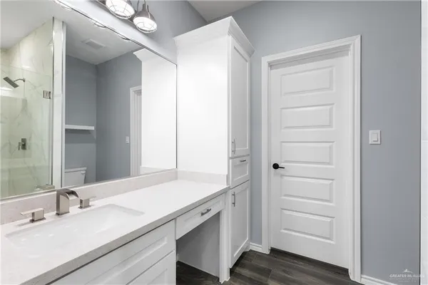 a bathroom with a sink and a mirror