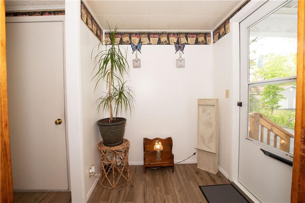 2251 Mercer Road Stoneboro, PA 16153 - Photo 6 of 15 a view of a room with wooden floor and furniture