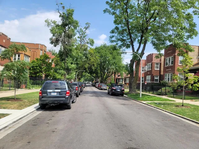 a view of a car parked in front of a house