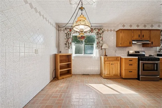 a view of a kitchen with storage and utility