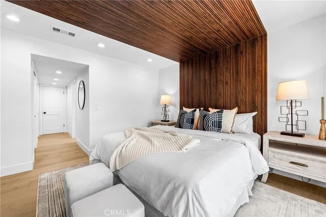 a bed room with a bed and a lamp