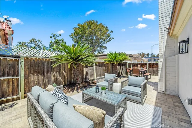 a view of a patio with couches and potted plants