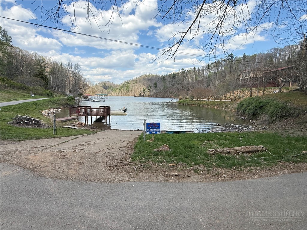 Lonesome Pine Trail Butler, TN 37640 - Photo 33 of 41 a view of a lake with a yard and large trees