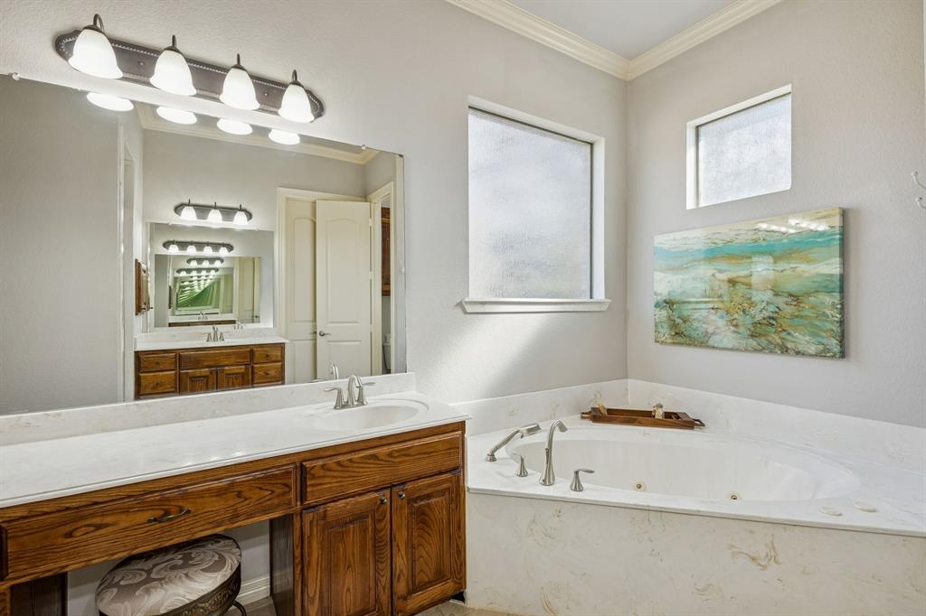 1520 Snider Court Lucas, TX 75002 - Photo 15 of 40 Primary suite features split vanities, one with a knee space, walk in shower, jetted tub, and private commode room.