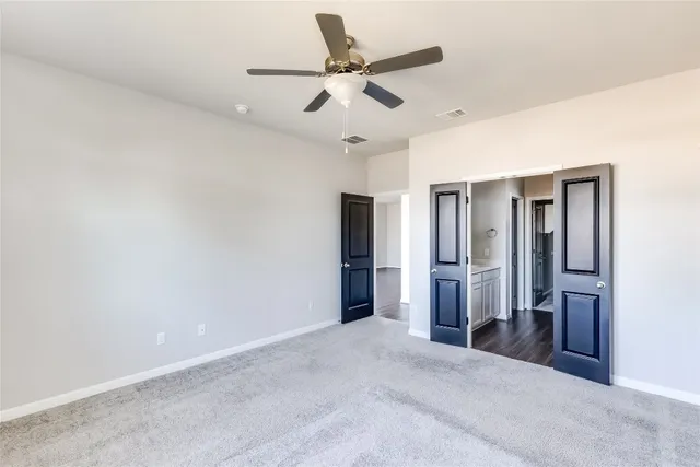 a view of a livingroom with a ceiling fan