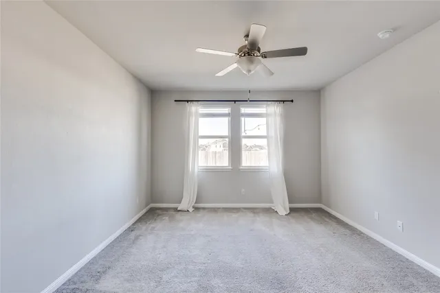 wooden floor and window in an empty room
