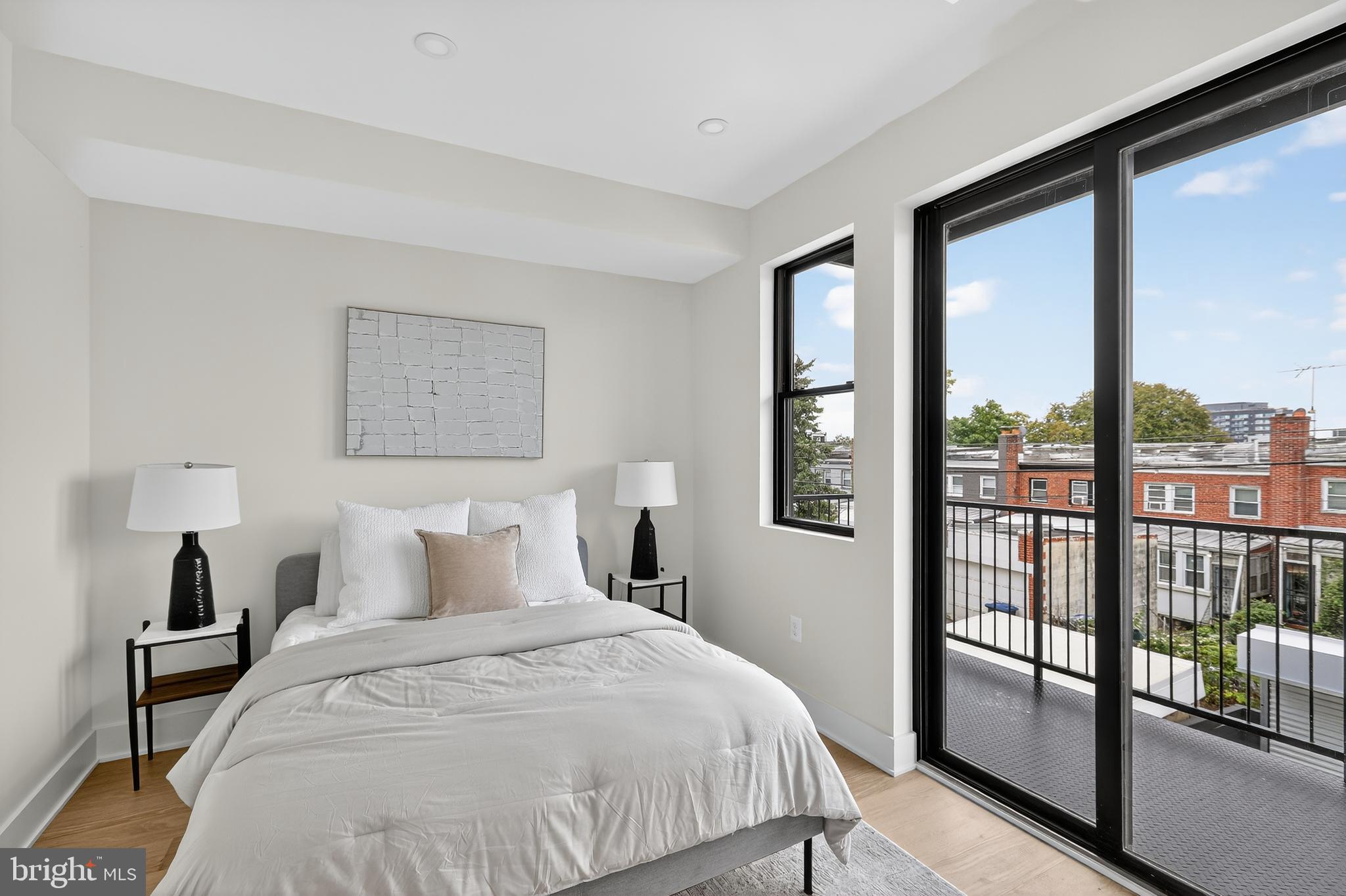 828 21st Street Northeast, Unit 2 Washington, DC 20002 - Photo 15 of 27 a bedroom with a large window and a balcony