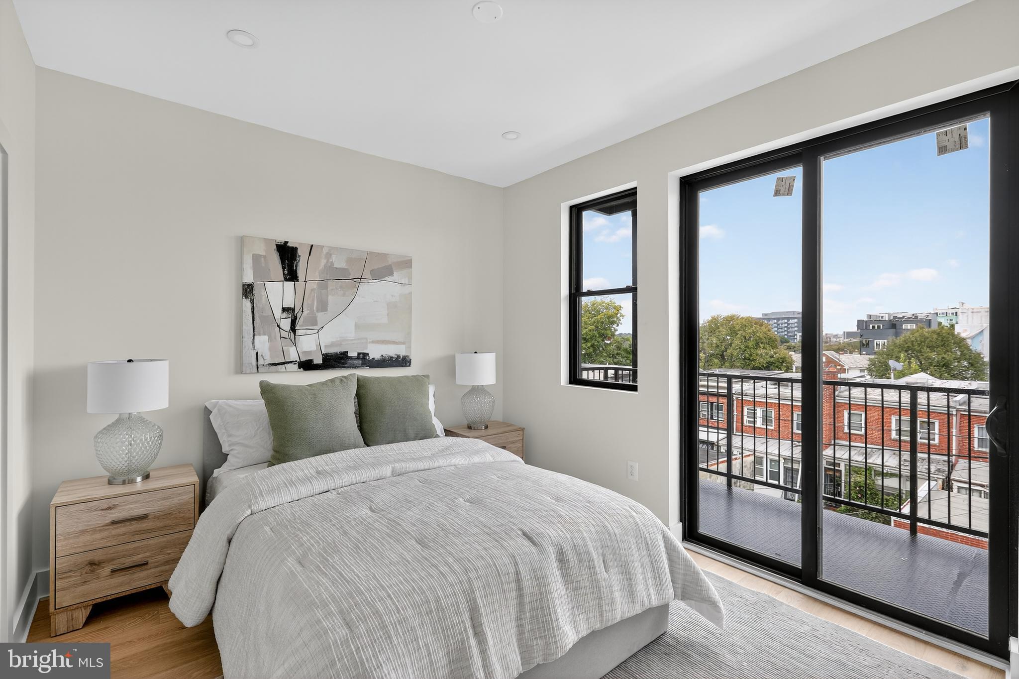 828 21st Street Northeast, Unit 2 Washington, DC 20002 - Photo 18 of 27 a bedroom with a large bed and a large window