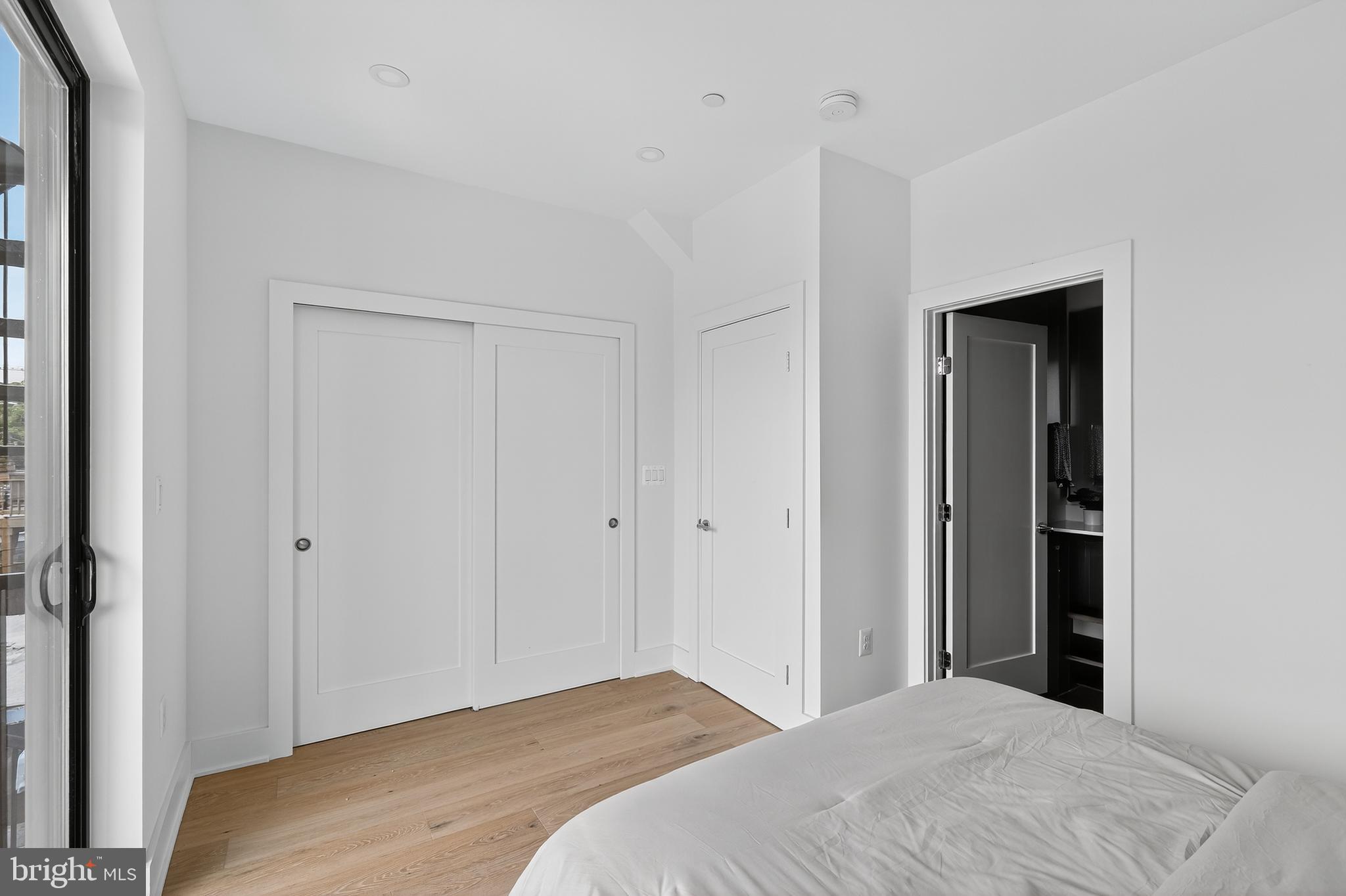 828 21st Street Northeast, Unit 2 Washington, DC 20002 - Photo 19 of 27 a bedroom with a bed and a closet