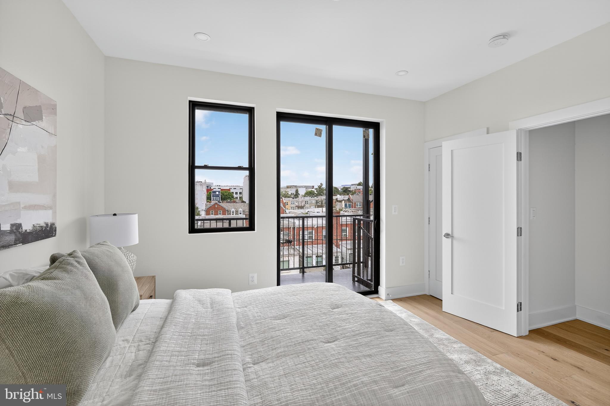 828 21st Street Northeast, Unit 2 Washington, DC 20002 - Photo 21 of 27 a bedroom with a large bed and a window
