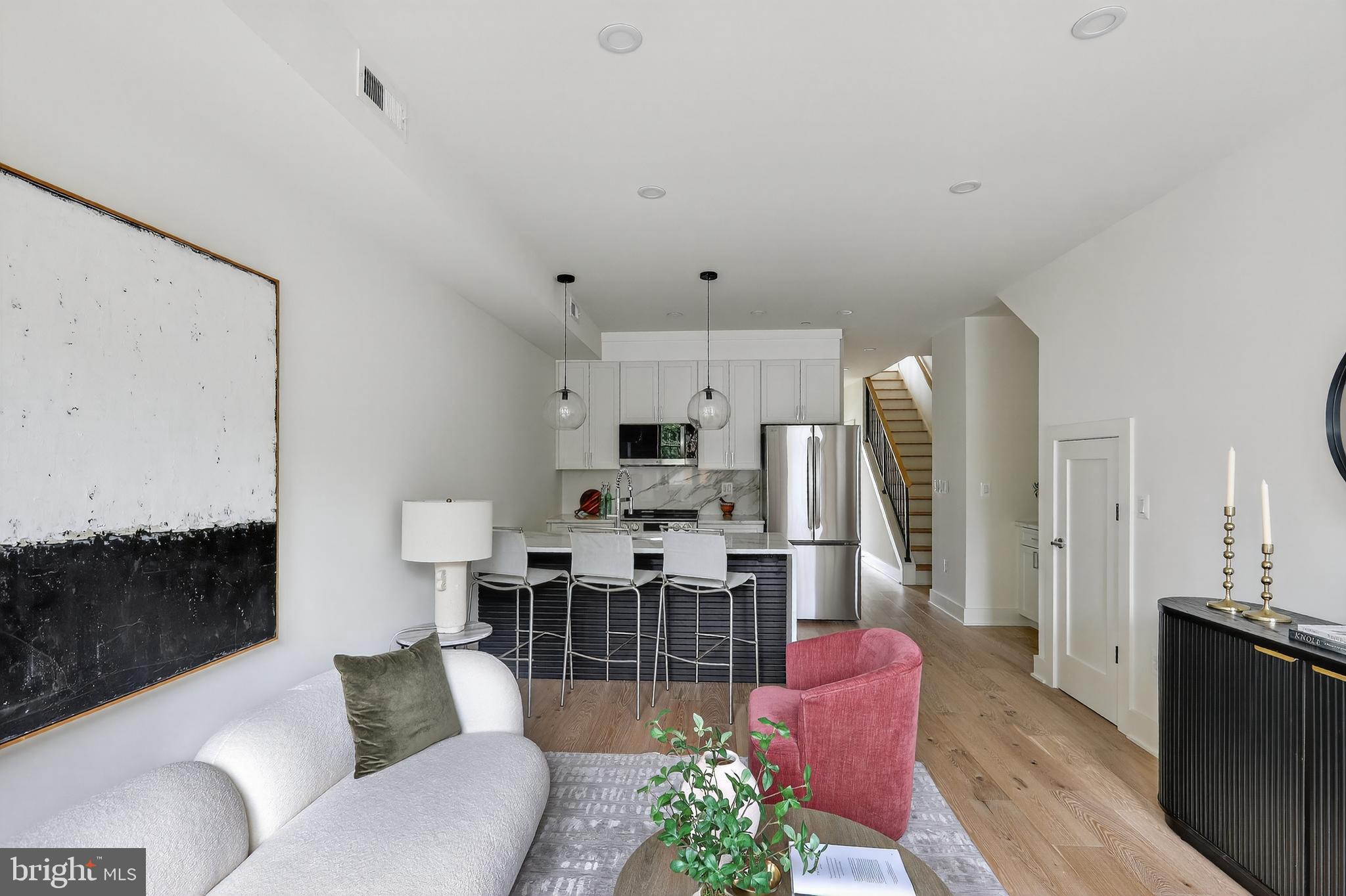 828 21st Street Northeast, Unit 2 Washington, DC 20002 - Photo 6 of 27 a living room with furniture and a flat screen tv