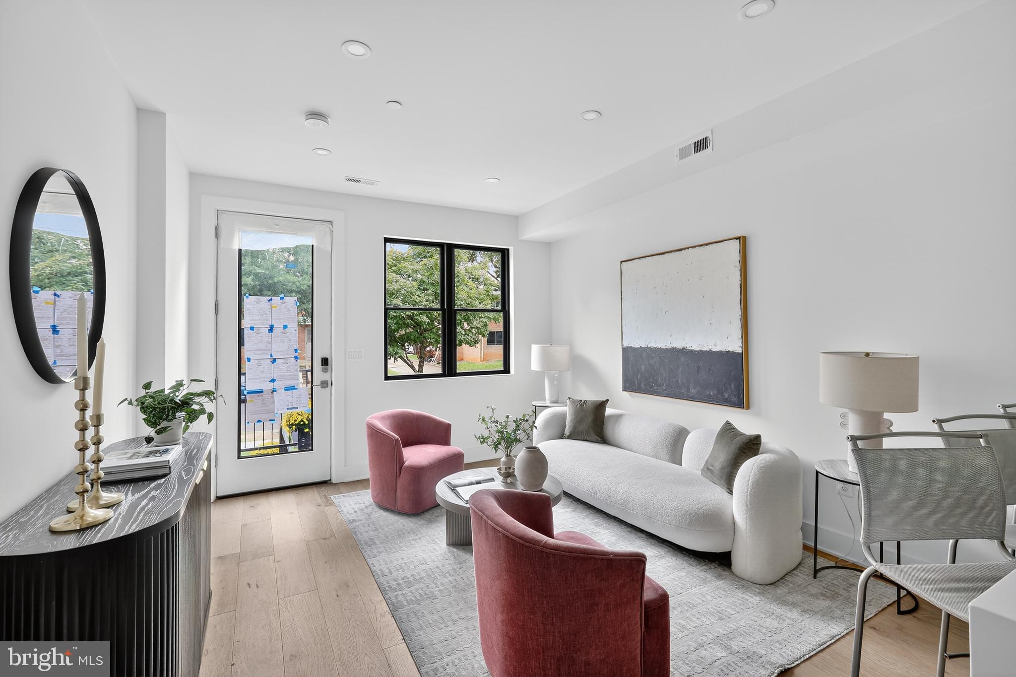 828 21st Street Northeast, Unit 2 Washington, DC 20002 - Photo 7 of 27 a living room with furniture and a large window