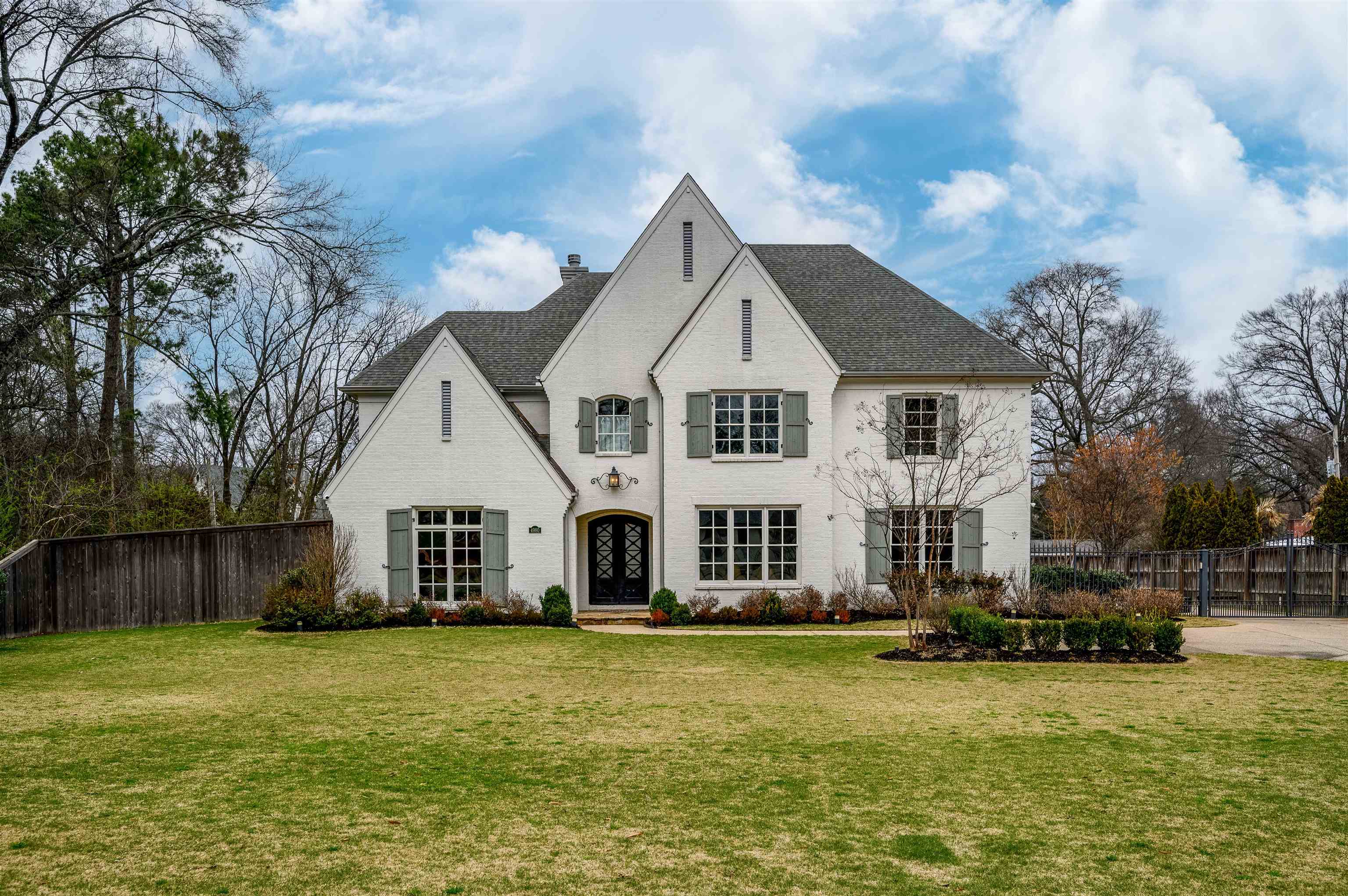 4980 Cole Road Memphis, TN 38117 - Photo 1 of 25 a front view of a house with a yard
