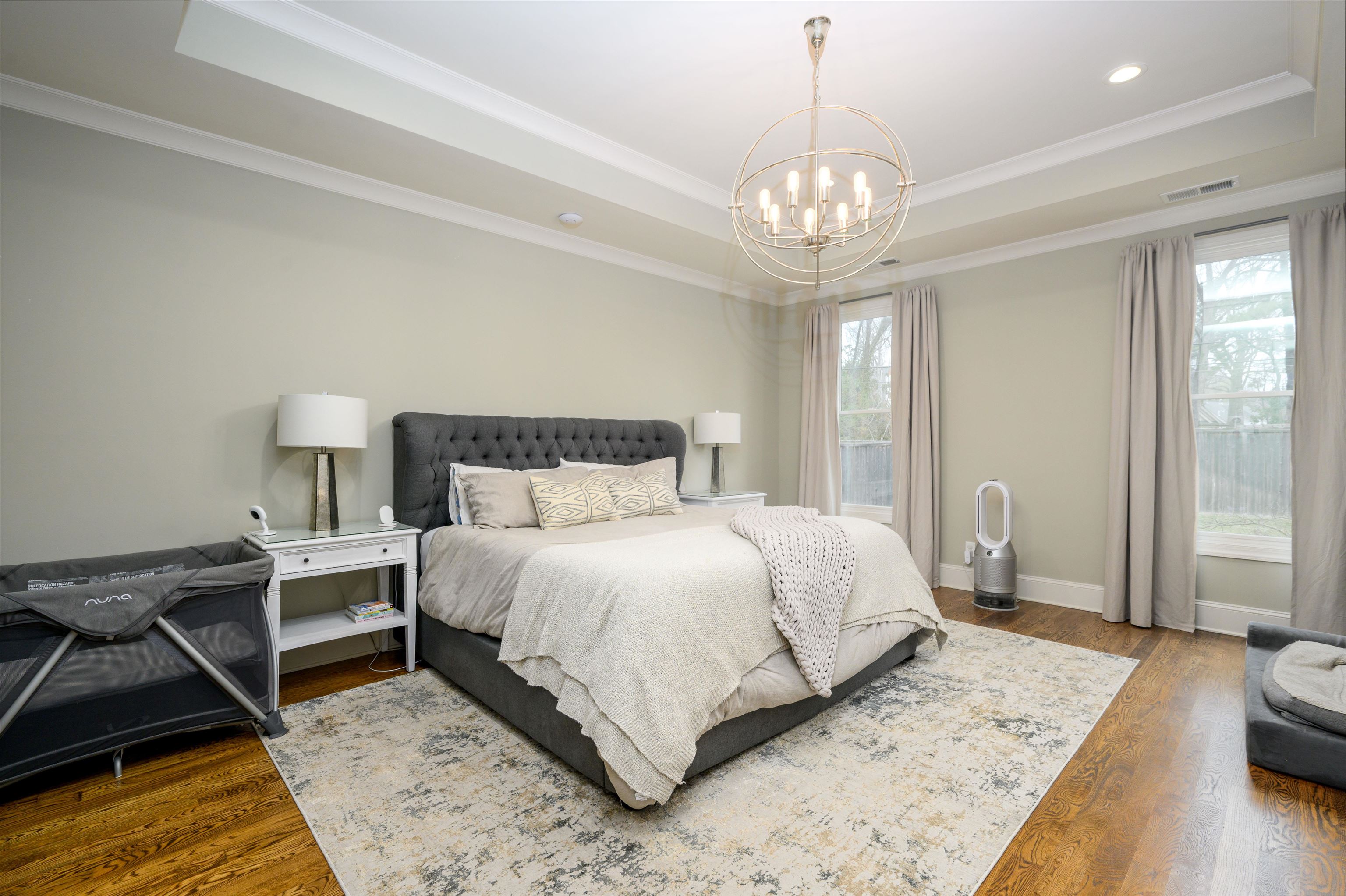 4980 Cole Road Memphis, TN 38117 - Photo 13 of 25 a bedroom with a bed and a chandelier
