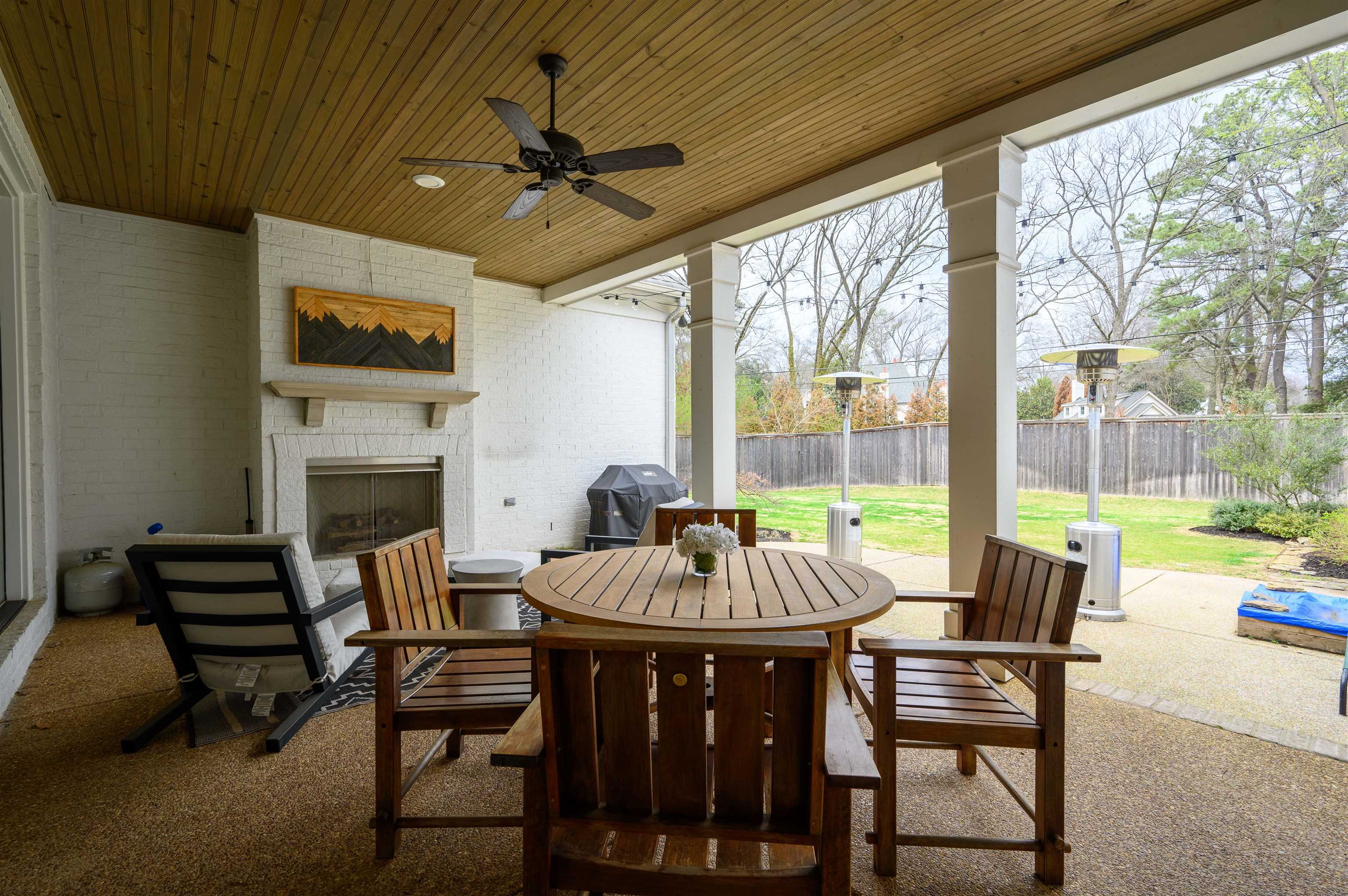 4980 Cole Road Memphis, TN 38117 - Photo 23 of 25 a view of a dining room with furniture wooden floor and a fireplace