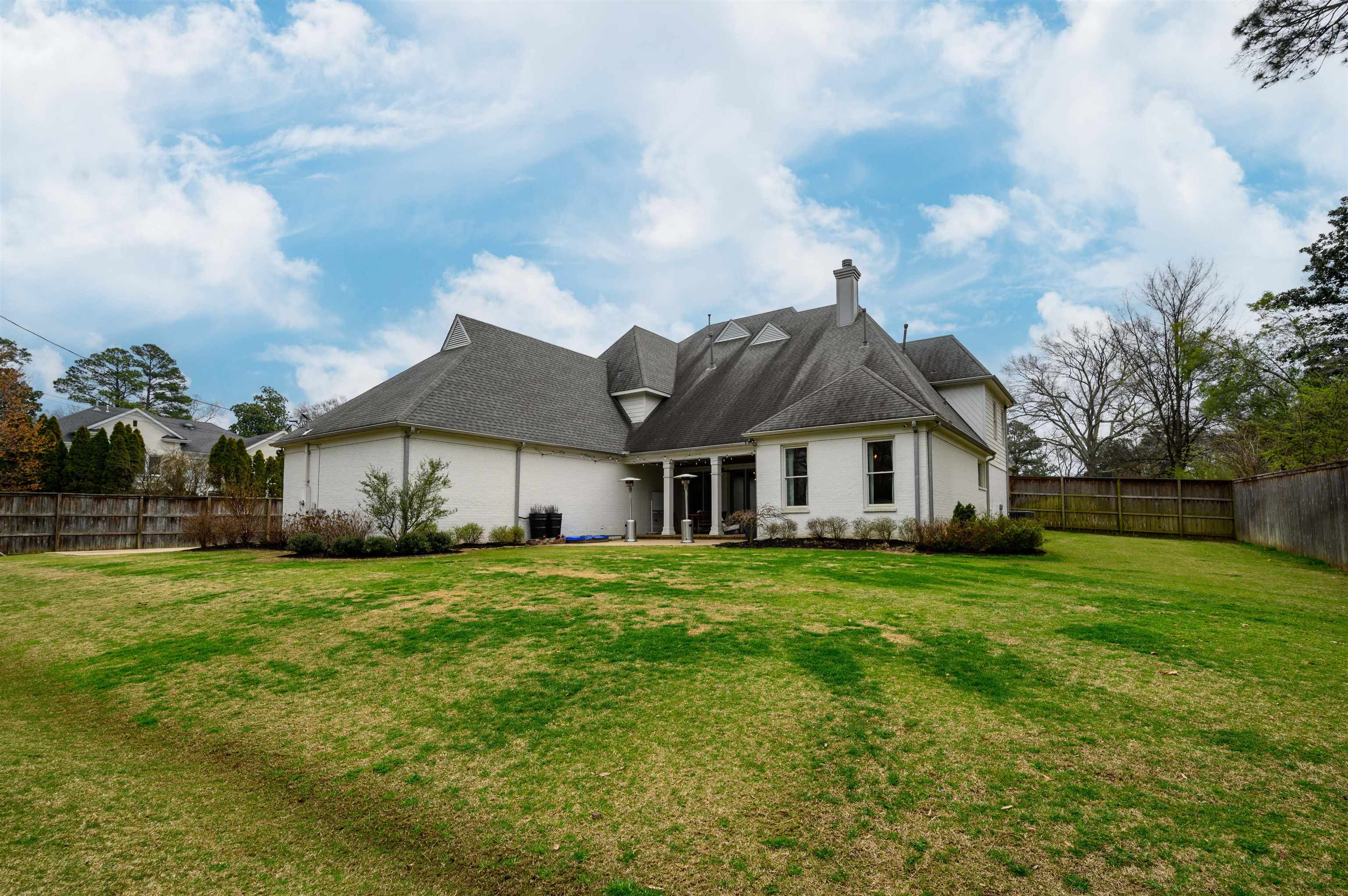 4980 Cole Road Memphis, TN 38117 - Photo 24 of 25 a big house with a big yard and large trees