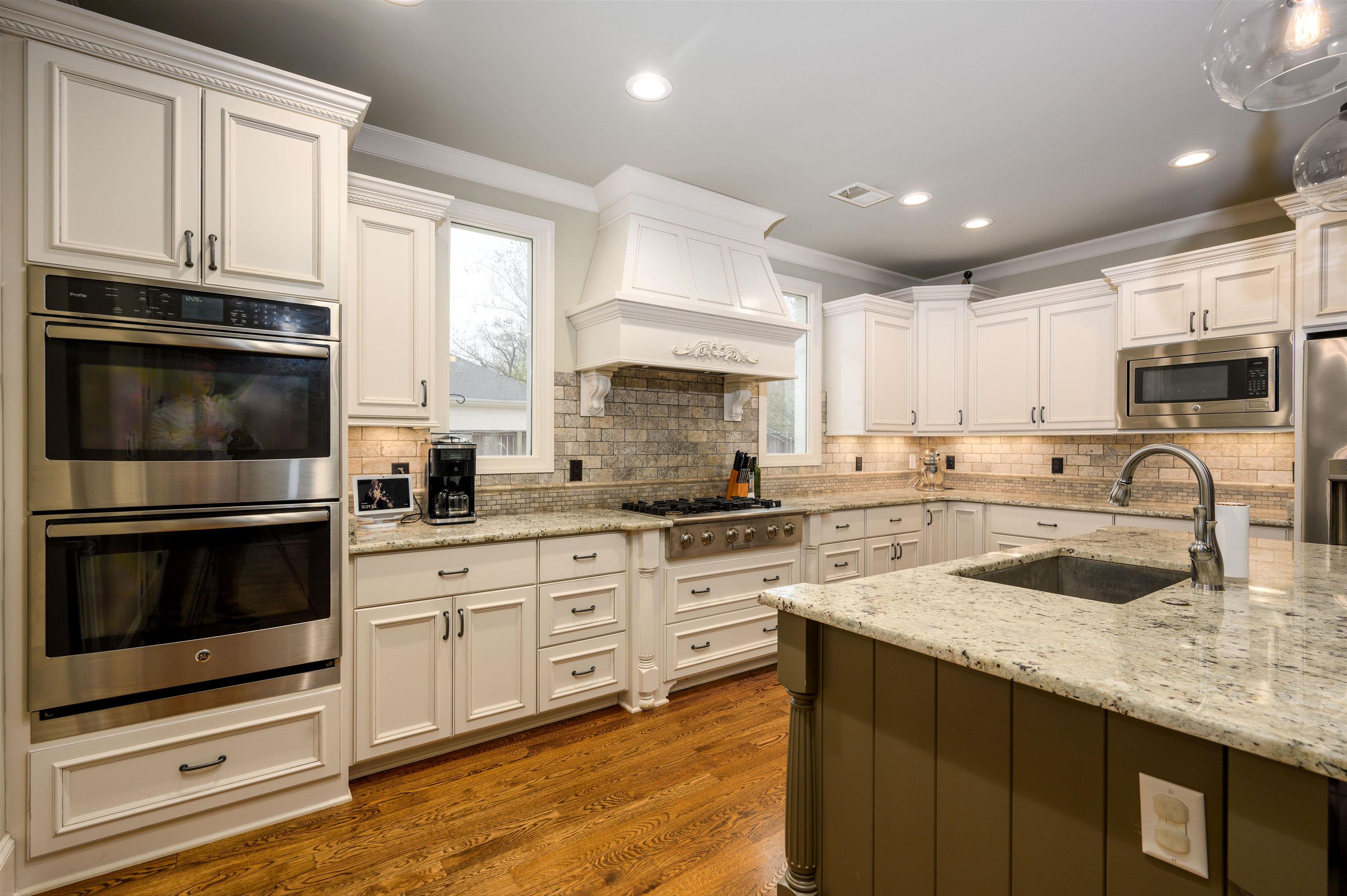 4980 Cole Road Memphis, TN 38117 - Photo 8 of 25 a kitchen with granite countertop a sink stainless steel appliances and cabinets