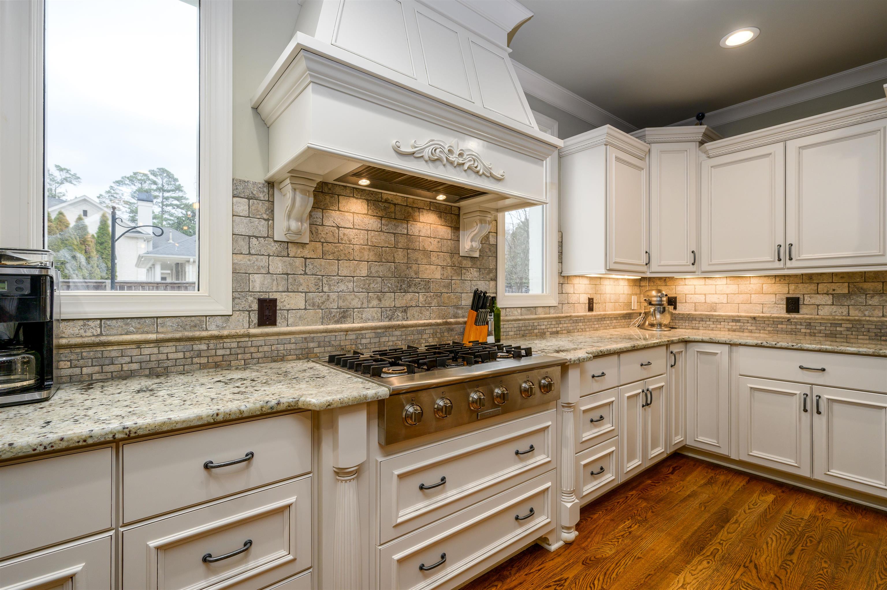 4980 Cole Road Memphis, TN 38117 - Photo 9 of 25 a kitchen with stainless steel appliances granite countertop a stove and a sink