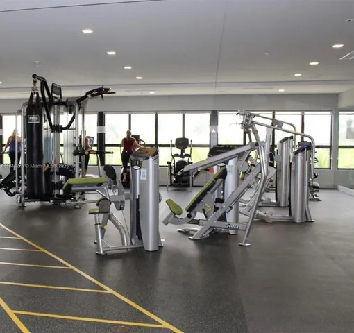 a view of chairs and umbrellas in the balcony