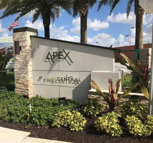 a view of a building and car parked