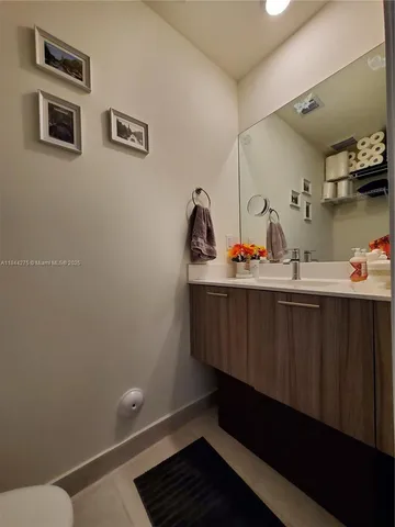 a room with a sink and cabinets