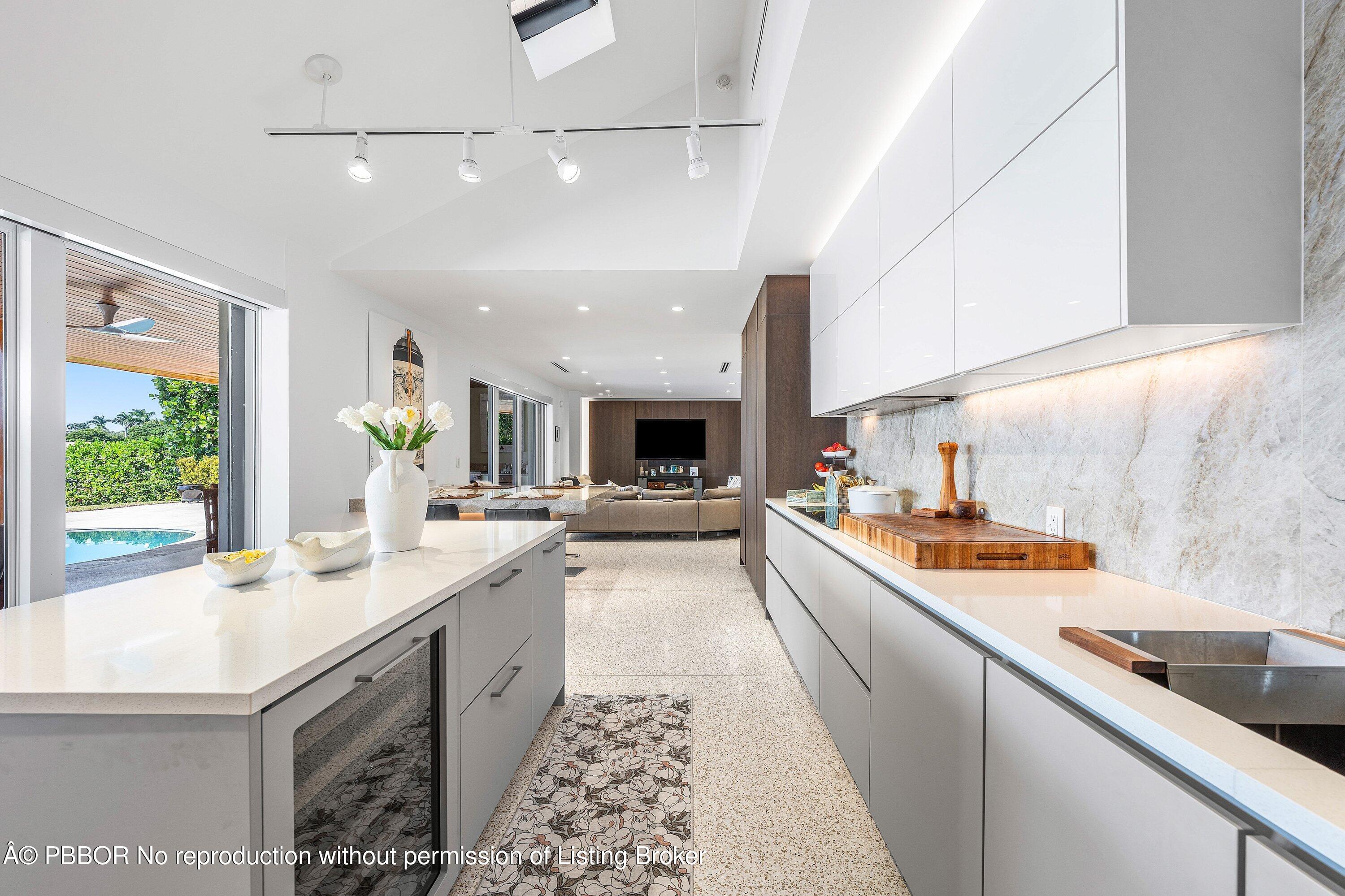 50 Spoonbill Road Lantana, FL 33462 - Photo 12 of 38 a large kitchen with a stove and a sink