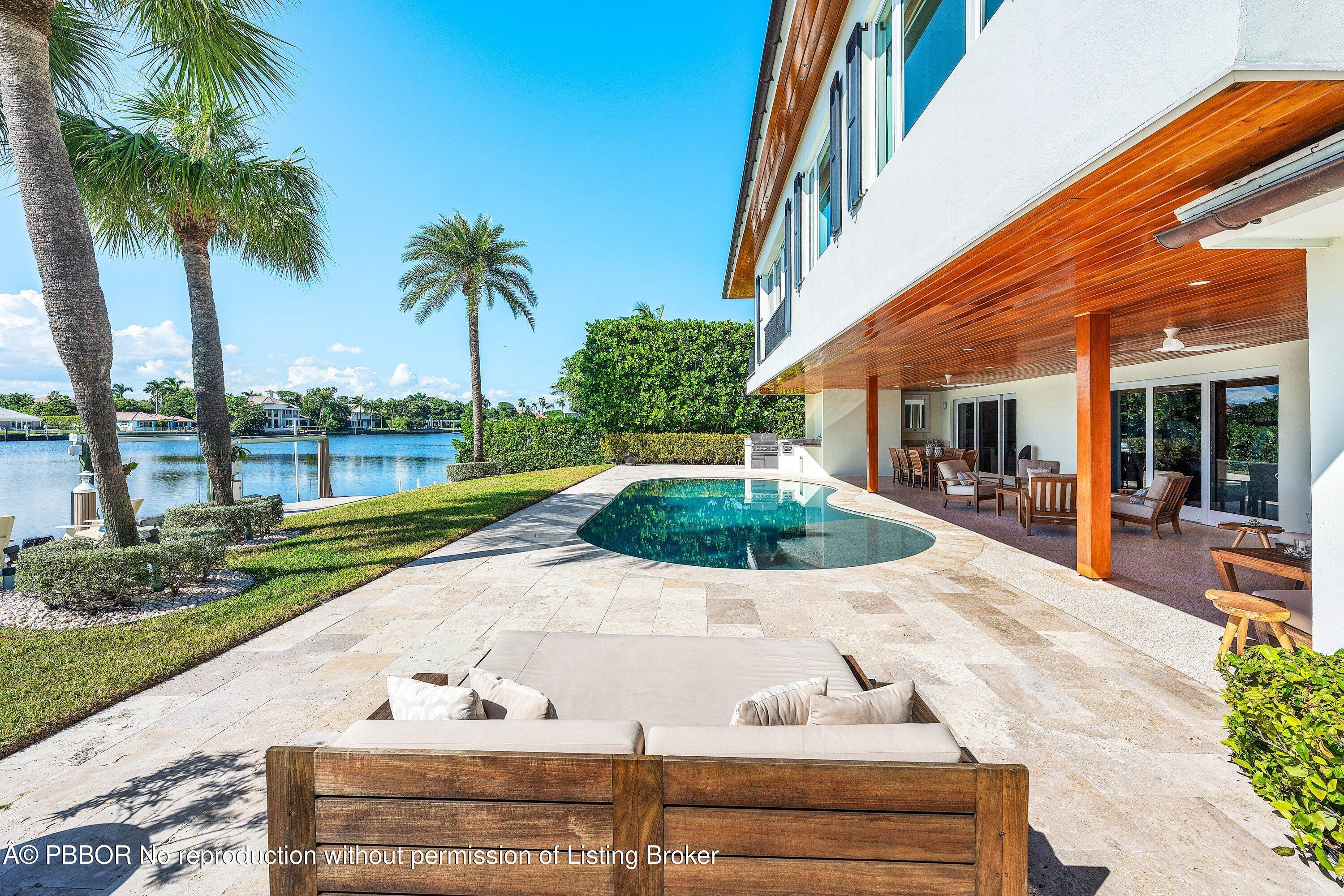 50 Spoonbill Road Lantana, FL 33462 - Photo 3 of 38 a view of a backyard with palm plants
