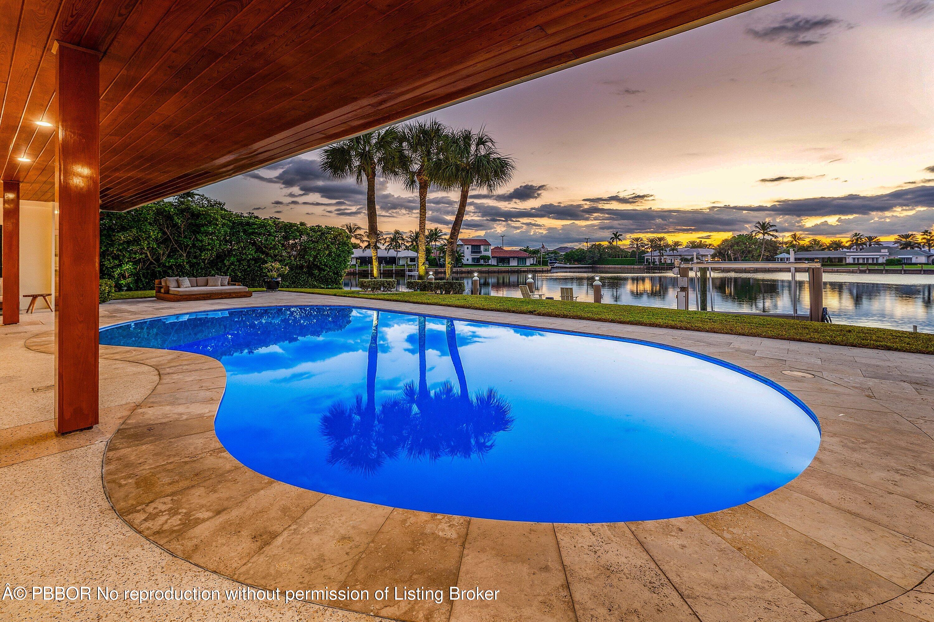 50 Spoonbill Road Lantana, FL 33462 - Photo 33 of 38 a view of a swimming pool with a chairs