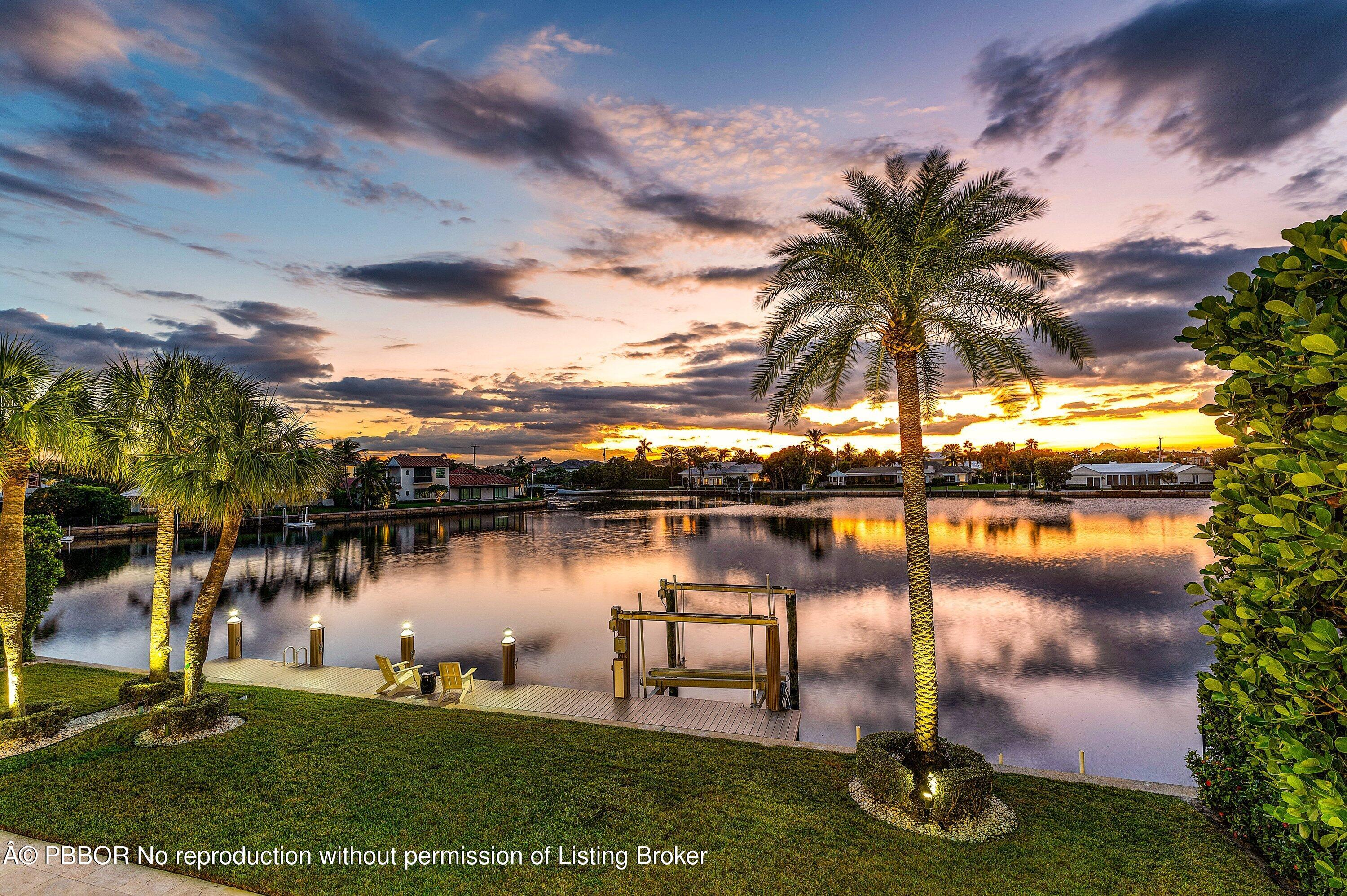 50 Spoonbill Road Lantana, FL 33462 - Photo 36 of 38 a swimming pool with outdoor seating and lake
