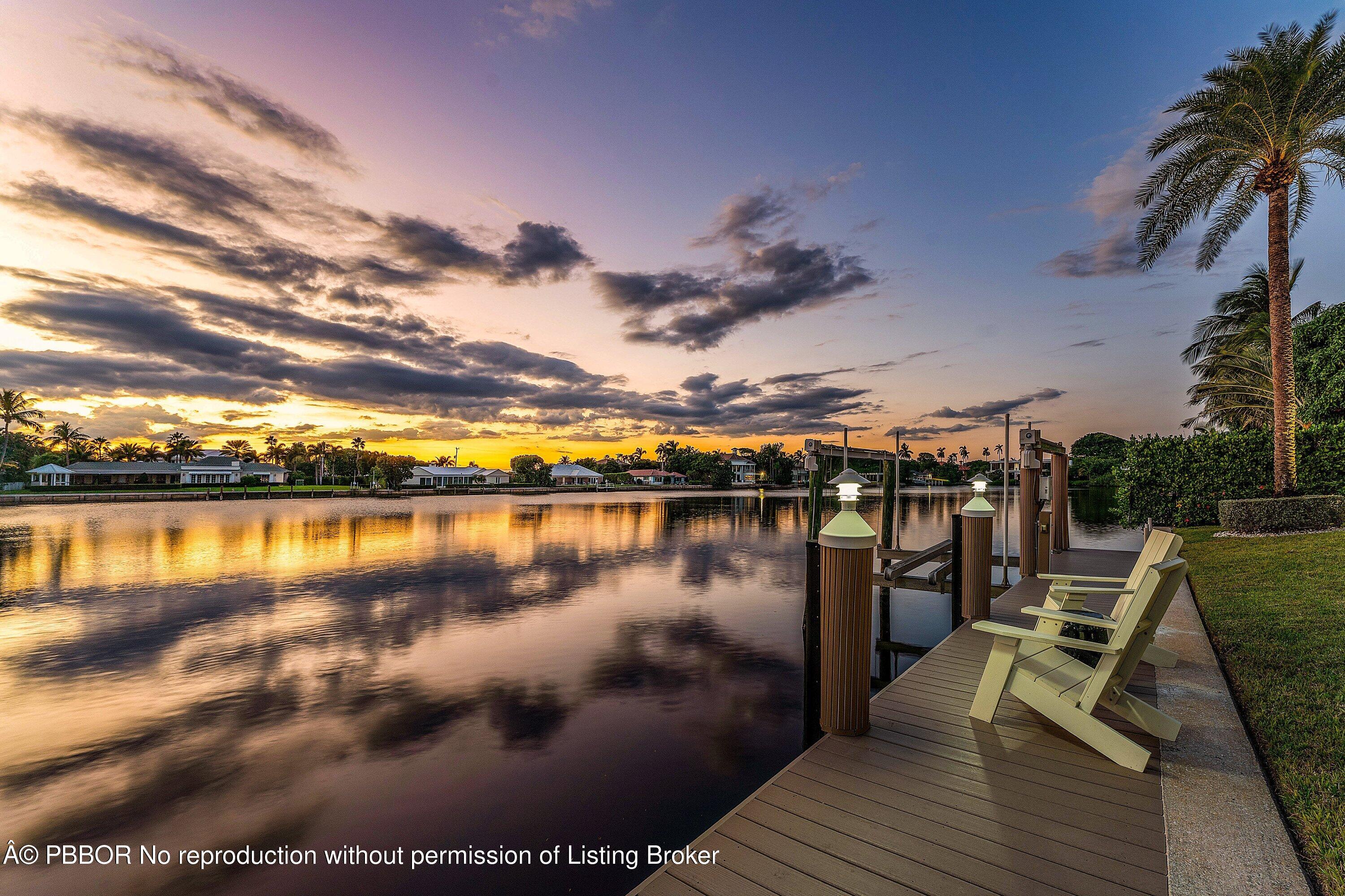 50 Spoonbill Road Lantana, FL 33462 - Photo 37 of 38 a view of a lake with a table and chairs