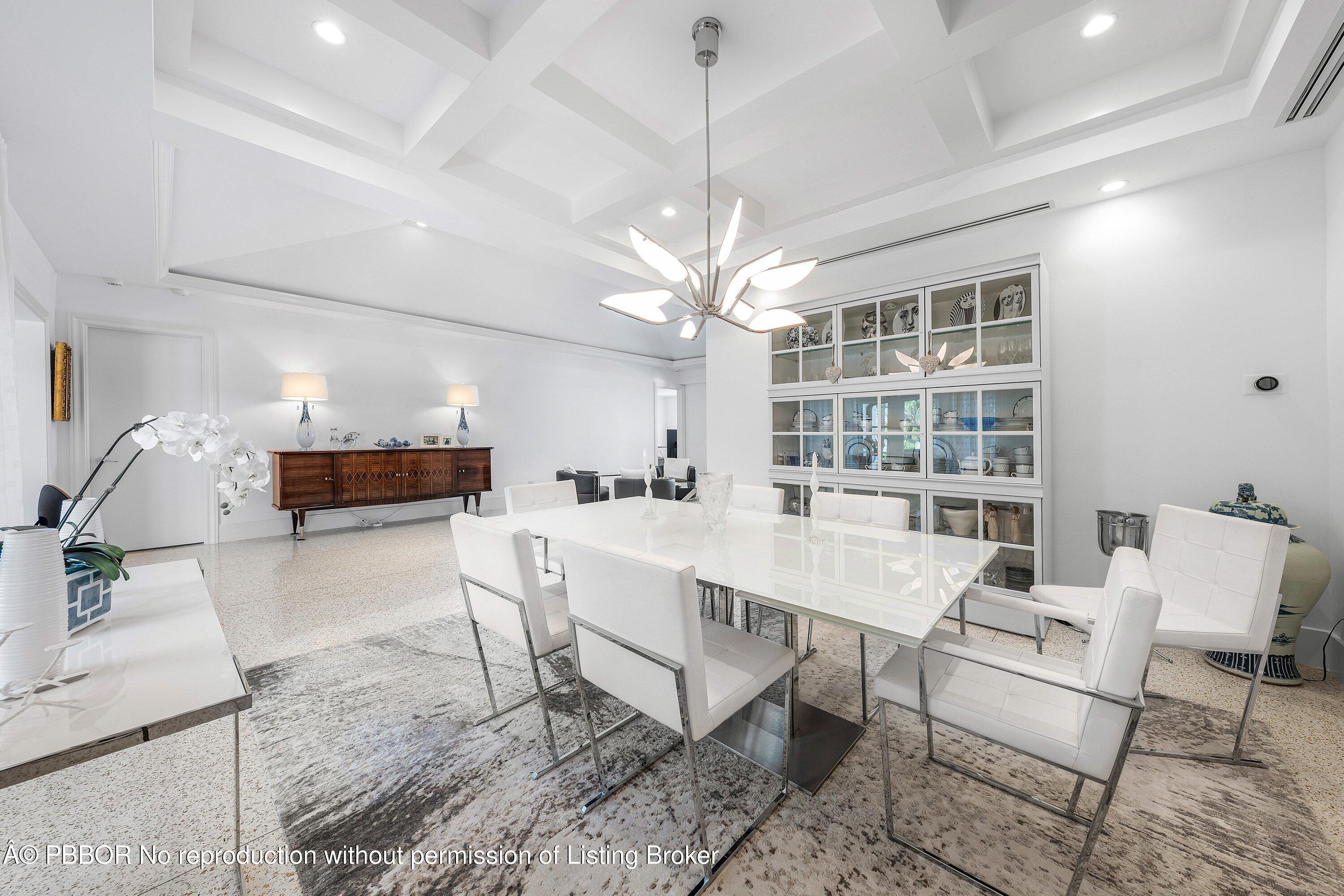 50 Spoonbill Road Lantana, FL 33462 - Photo 9 of 38 a dining room with a table and chairs