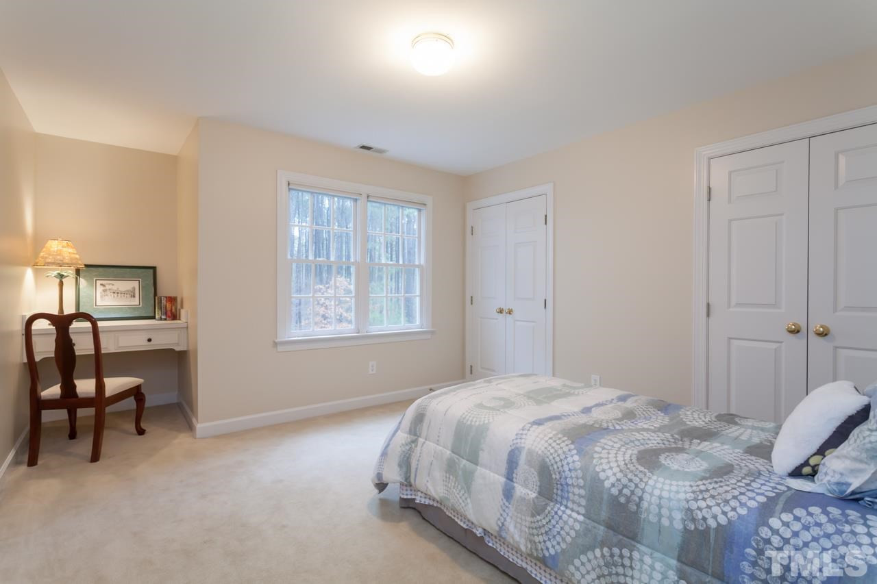 3709 White Chapel Way Raleigh, NC 27614 - Photo 14 of 25 Bedroom #3 has been freshly painted and provides a built in desk, a double window with plantation blinds, and a deep double-door closet. Bedroom #3
