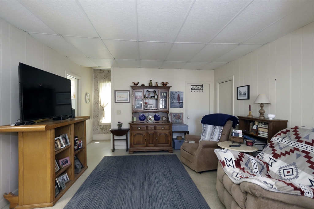 5 Anthony Street Acushnet, MA 02743 - Photo 17 of 37 a living room with furniture and a flat screen tv