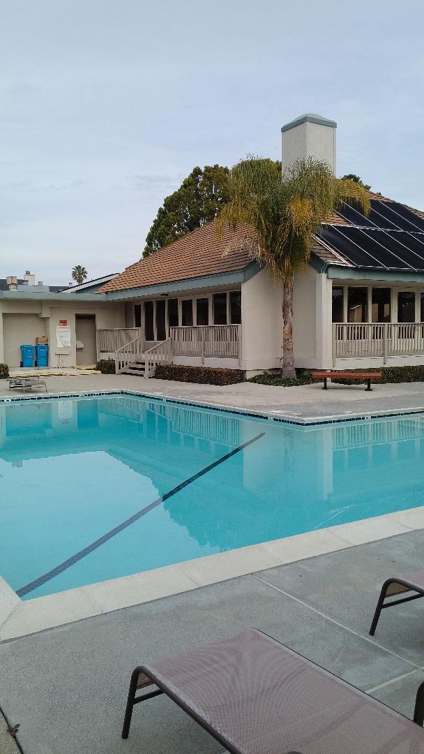 625 Celestial Lane Foster City, CA 94404 - Photo 3 of 3 a front view of a house with a garden and lake view