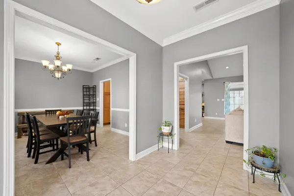 a kitchen with stainless steel appliances granite countertop wooden cabinets and a stove top oven