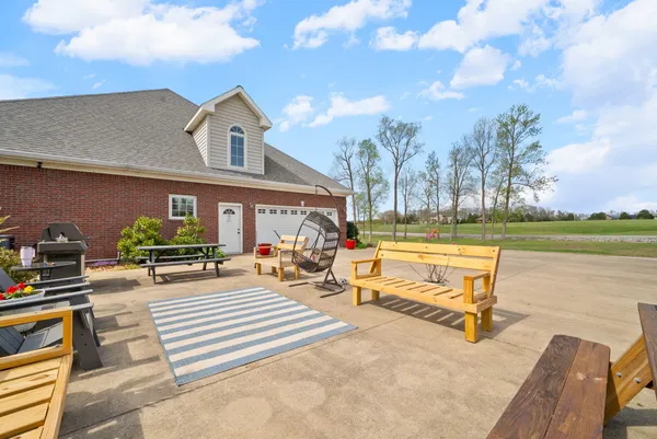 a front view of house with yard and green space